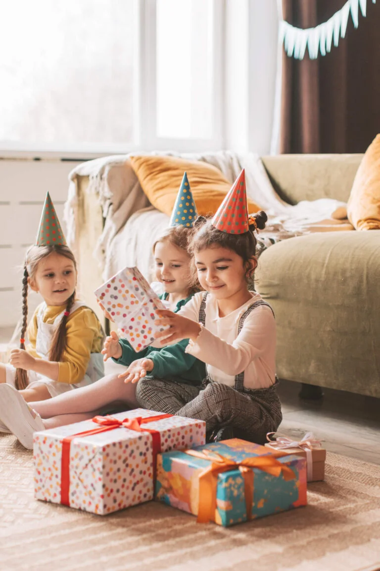 a group of children wearing party hats