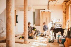 Family working in home together on house remodel construction diy project